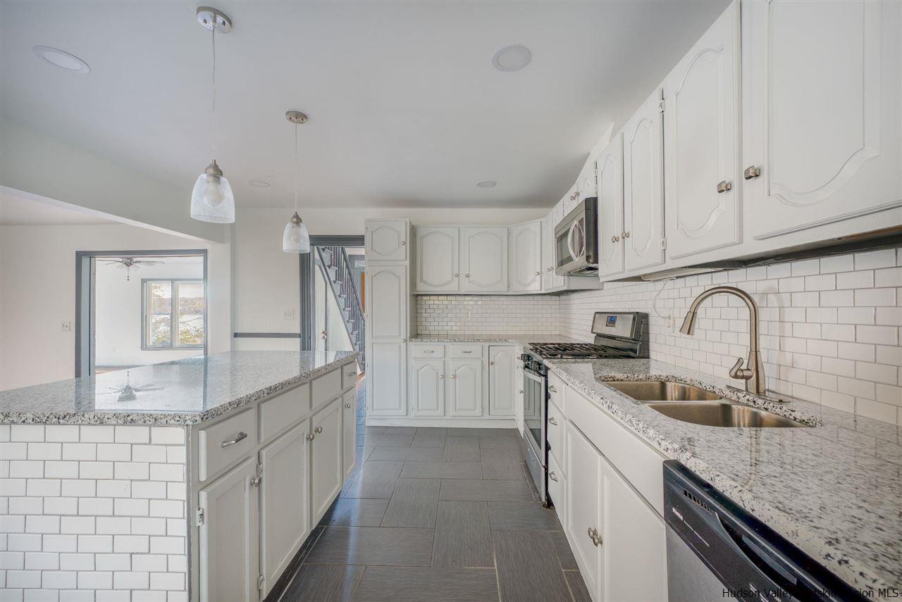 94 River Road Ulster Park, NY 12487 - Photo 17 of 31 a kitchen with granite countertop a sink stainless steel appliances and cabinets