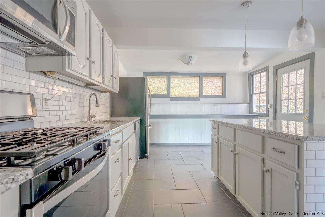 94 River Road Ulster Park, NY 12487 - Photo 18 of 31 a kitchen with stainless steel appliances a stove and a sink