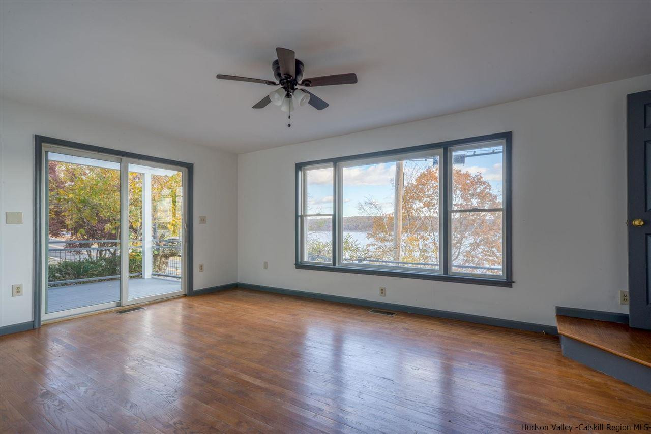 94 River Road Ulster Park, NY 12487 - Photo 19 of 31 a view of an empty room with wooden floor and a window