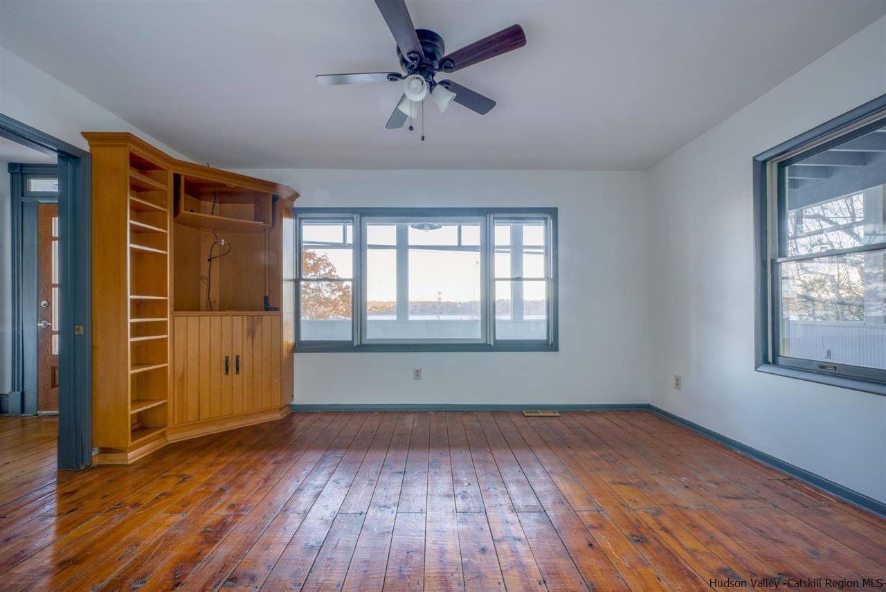 94 River Road Ulster Park, NY 12487 - Photo 20 of 31 wooden floor in an empty room with a window