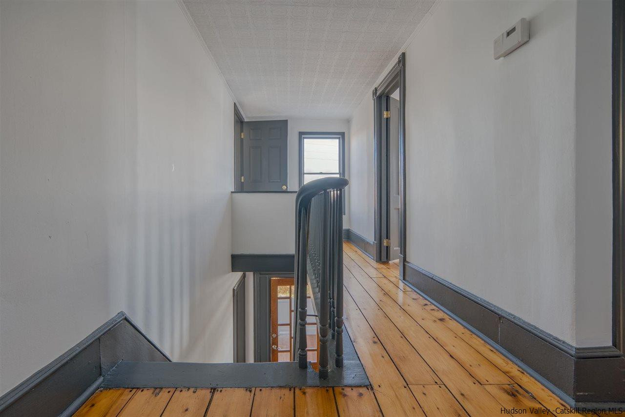 94 River Road Ulster Park, NY 12487 - Photo 21 of 31 a view of a hallway with wooden floor and staircase