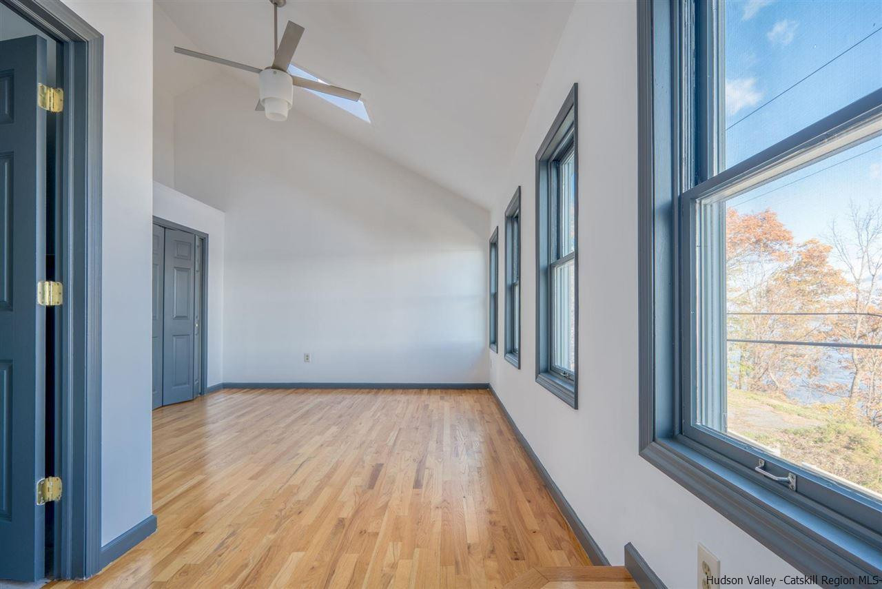 94 River Road Ulster Park, NY 12487 - Photo 22 of 31 a view of a hallway with wooden floor and staircase