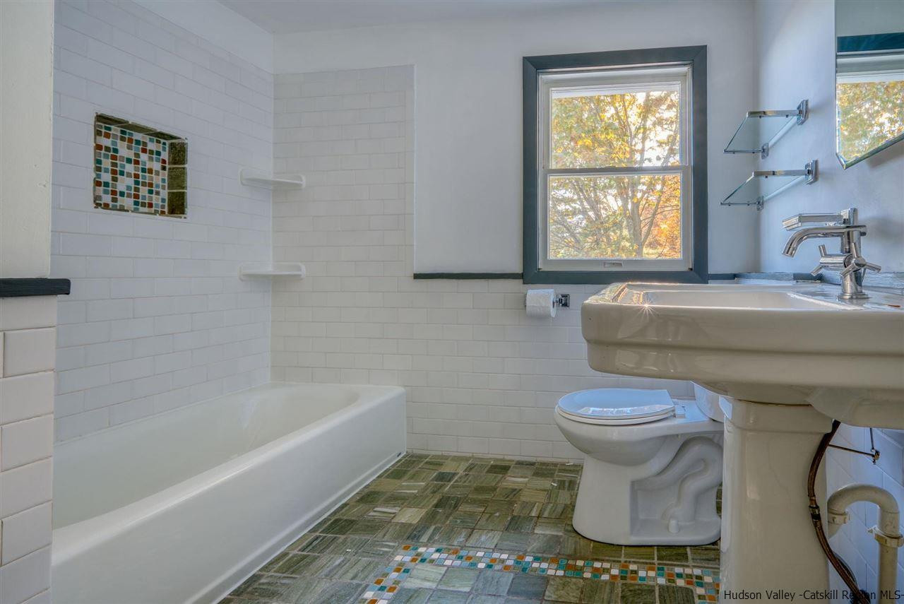94 River Road Ulster Park, NY 12487 - Photo 26 of 31 a bathroom with a toilet a sink and a bathtub