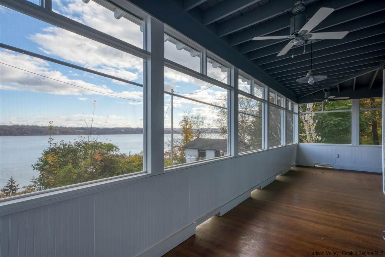 94 River Road Ulster Park, NY 12487 - Photo 29 of 31 a view of empty room with wooden floor and fan