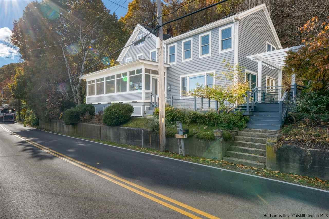 94 River Road Ulster Park, NY 12487 - Photo 5 of 31 a front view of a house with garden