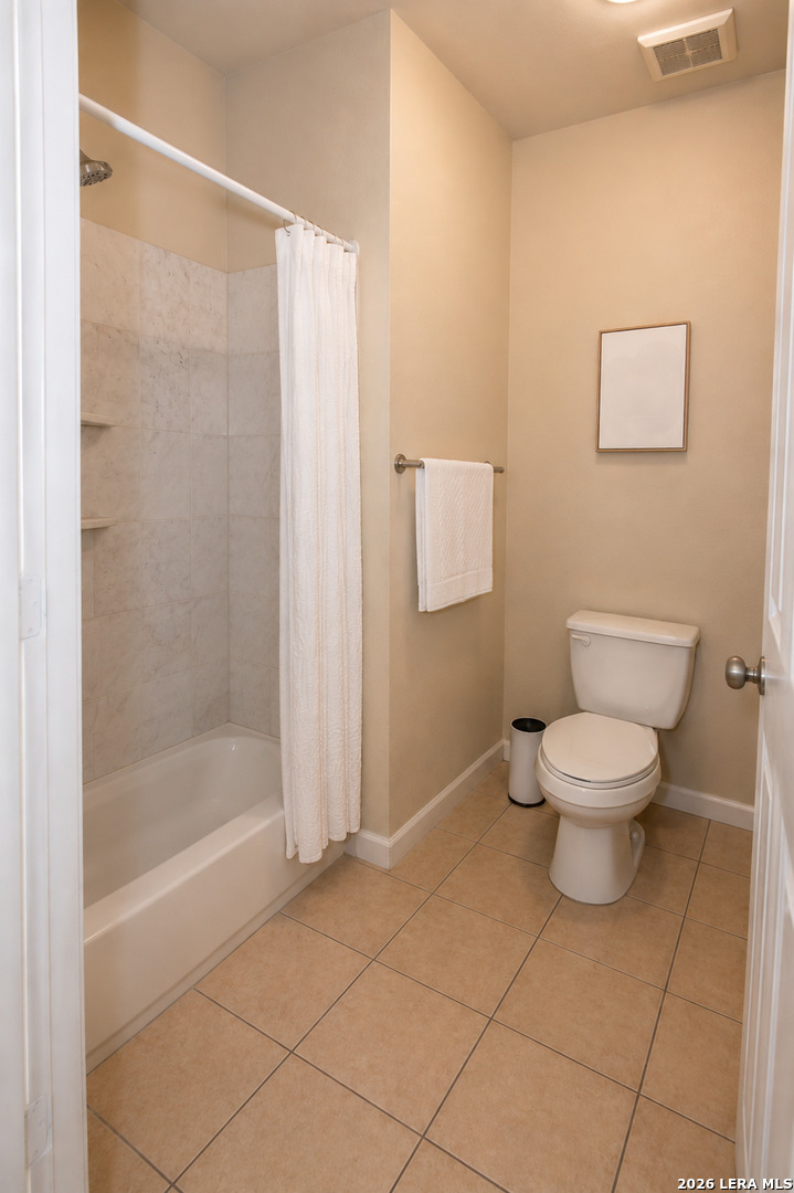 6160 Eckhert Road, Unit 804 San Antonio, TX 78240 - Photo 24 of 38 a bathroom with a toilet and a shower