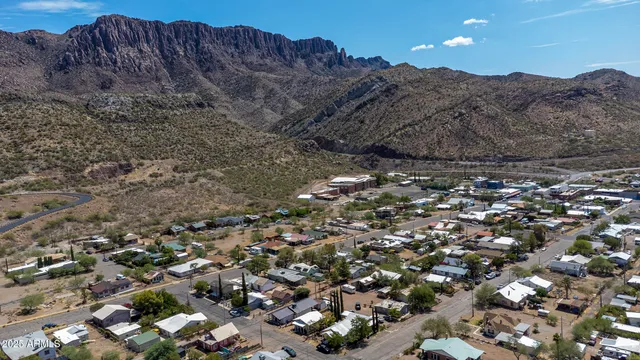 an aerial view of mountain with an ocean