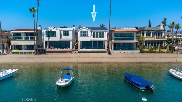 a room with a bed and a large window