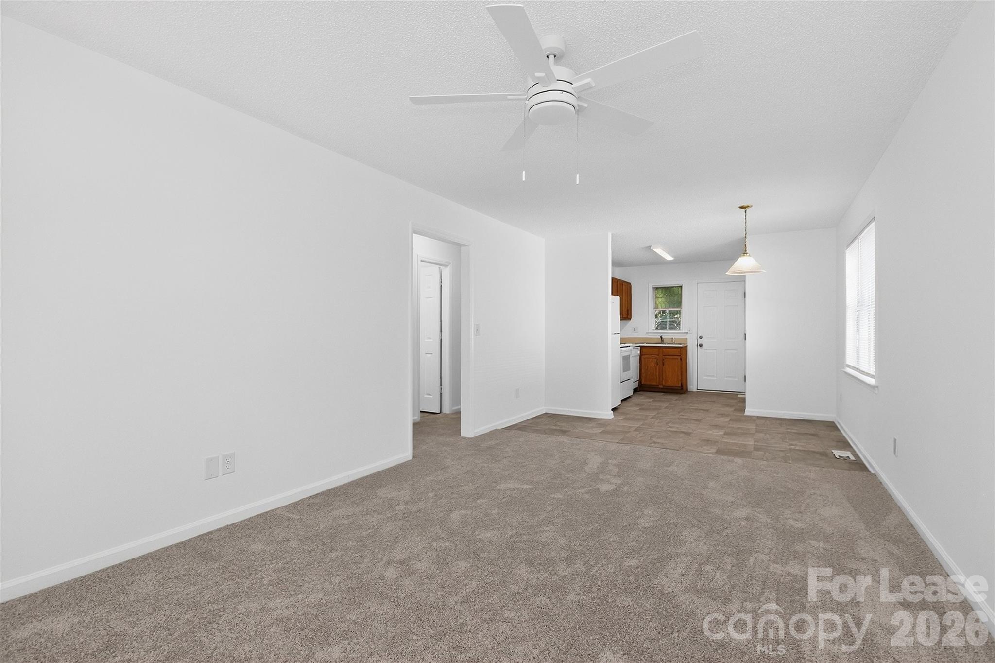 91-93 Sunderland Road Southwest, Unit 93 Concord, NC 28027 - Photo 6 of 30 an empty room with a kitchen