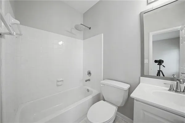 a bathroom with a toilet a sink and a bathtub