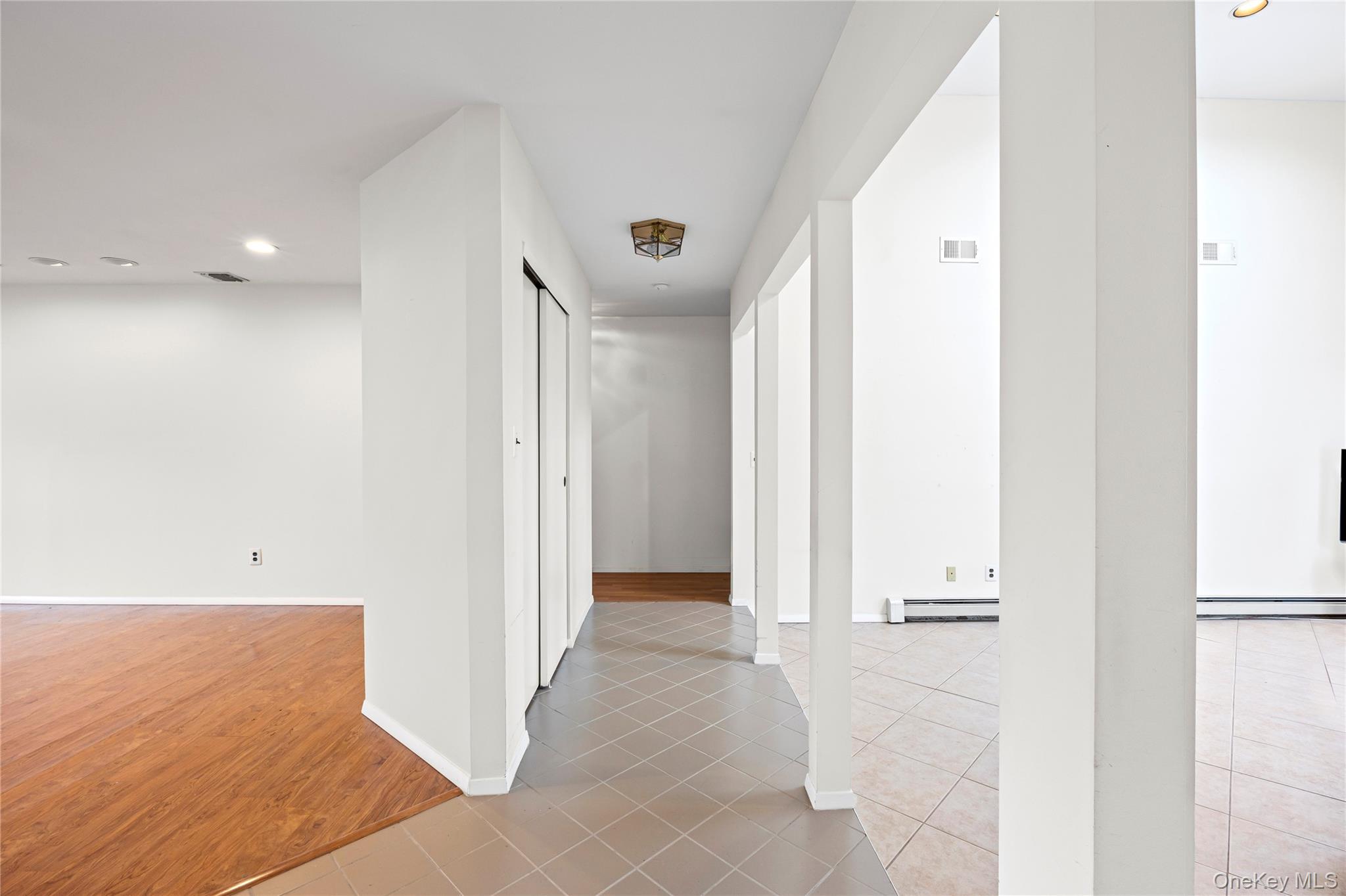 6 Hillview Court Commack, NY 11725 - Photo 10 of 43 a view of a hallway with wooden floor