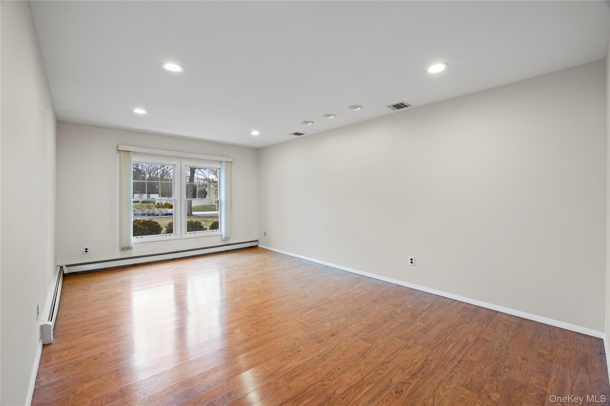 6 Hillview Court Commack, NY 11725 - Photo 12 of 43 a view of livingroom with hardwood