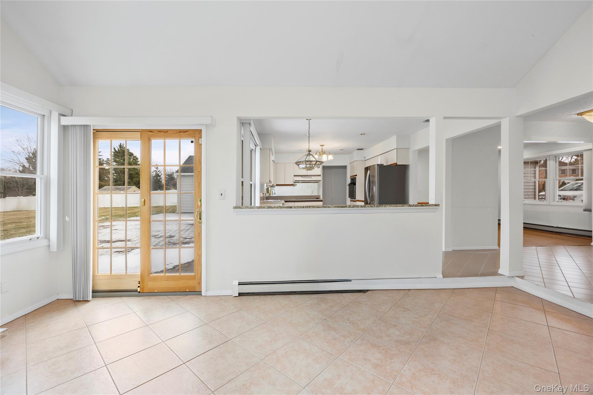 6 Hillview Court Commack, NY 11725 - Photo 14 of 43 a view of a kitchen with an empty space and a window