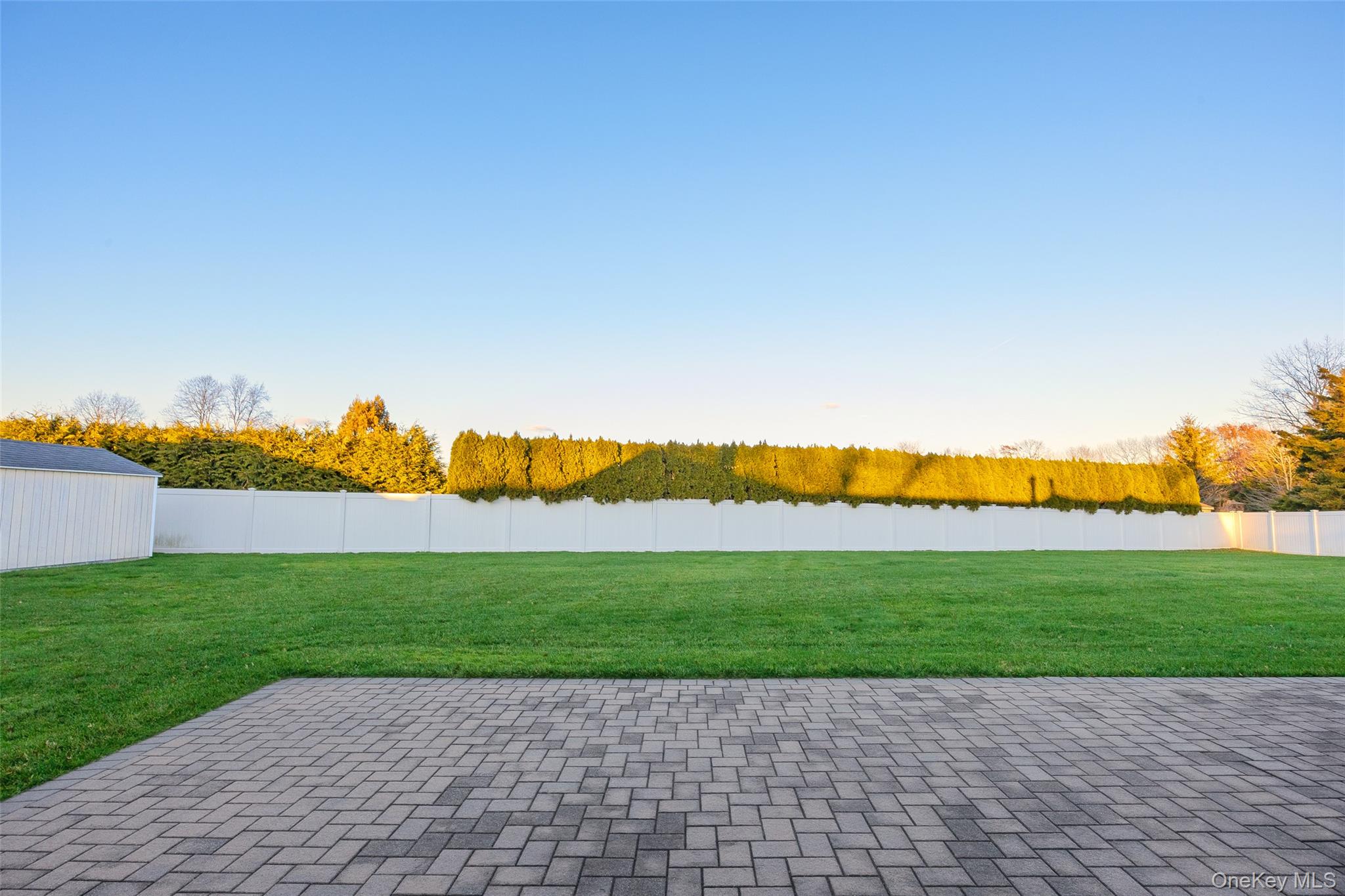 6 Hillview Court Commack, NY 11725 - Photo 15 of 43 a view of a backyard with a garden