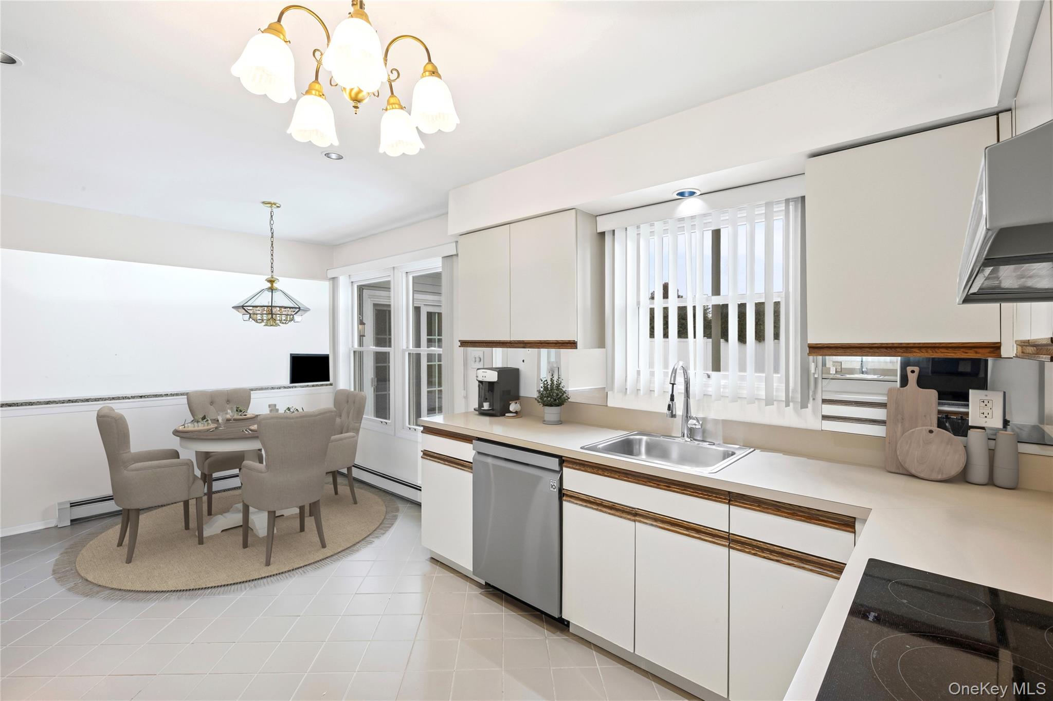 6 Hillview Court Commack, NY 11725 - Photo 16 of 43 a kitchen with a table and chairs