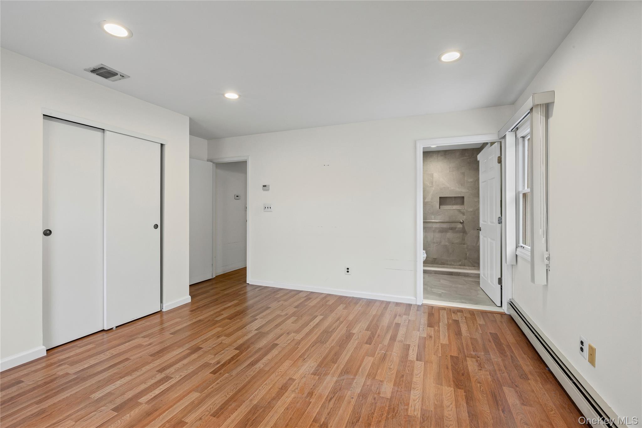 6 Hillview Court Commack, NY 11725 - Photo 20 of 43 wooden floor in an empty room with wooden floor