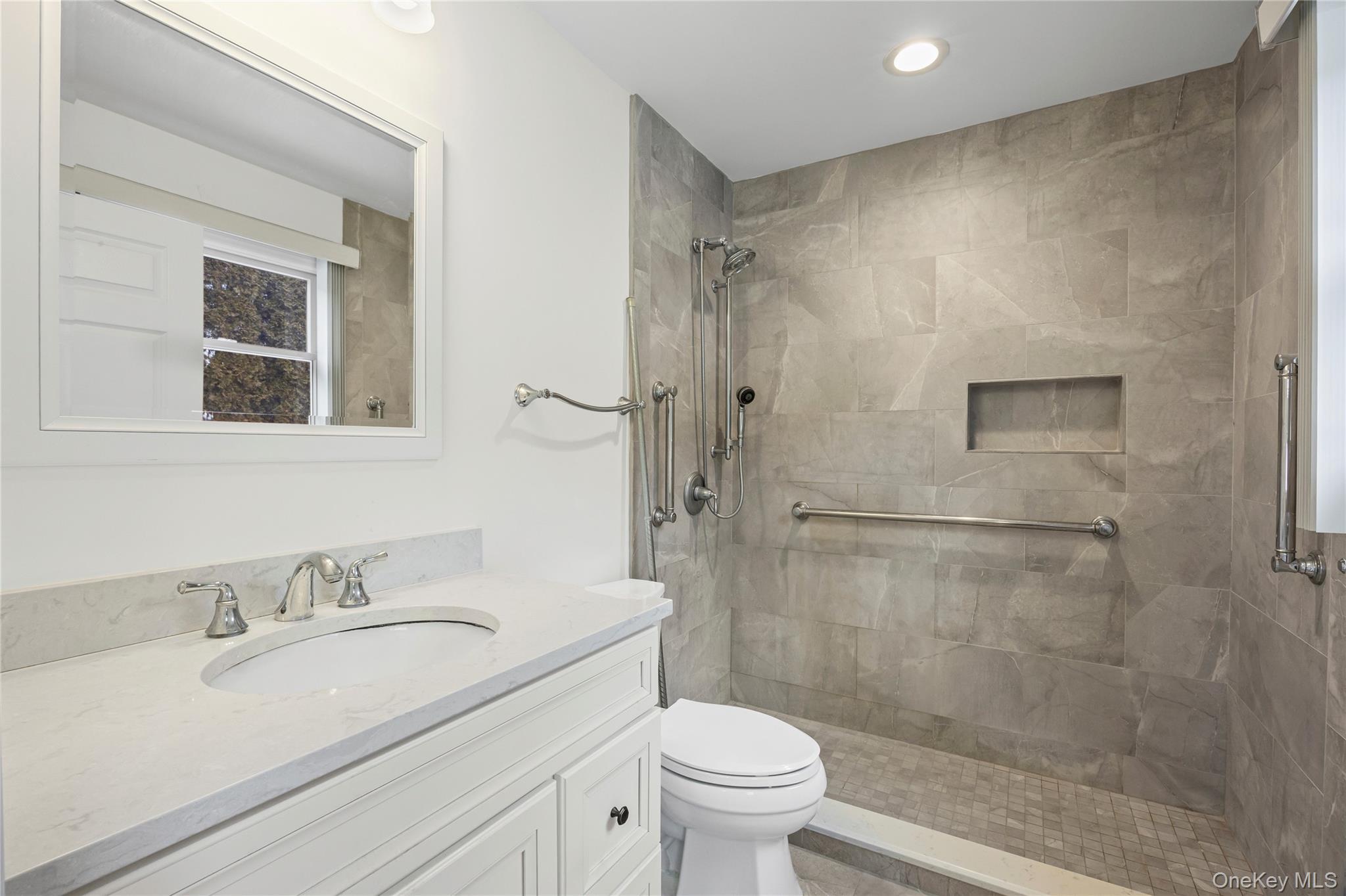 6 Hillview Court Commack, NY 11725 - Photo 21 of 43 a bathroom with a granite countertop sink toilet and shower