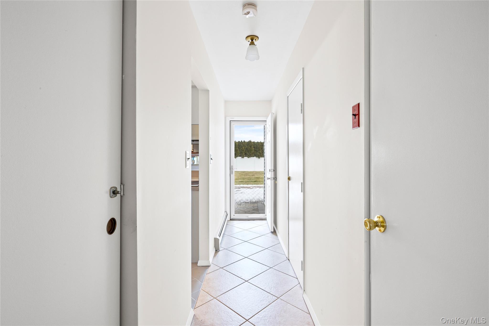 6 Hillview Court Commack, NY 11725 - Photo 25 of 43 a view of a bathroom with a shower and a mirror