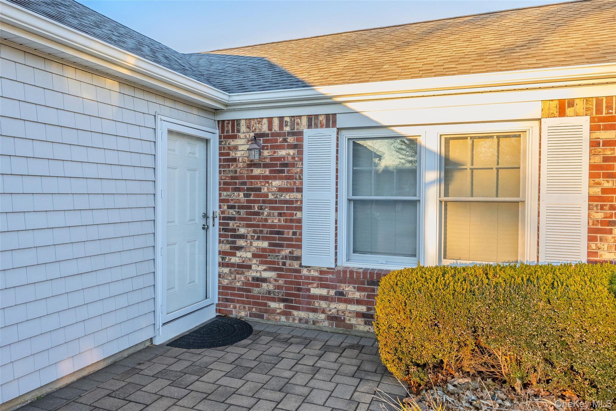 6 Hillview Court Commack, NY 11725 - Photo 27 of 43 a view of a brick house with a large windows
