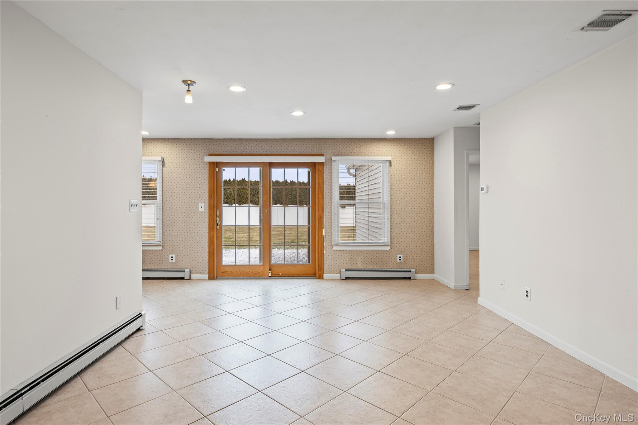 6 Hillview Court Commack, NY 11725 - Photo 30 of 43 an empty room with windows