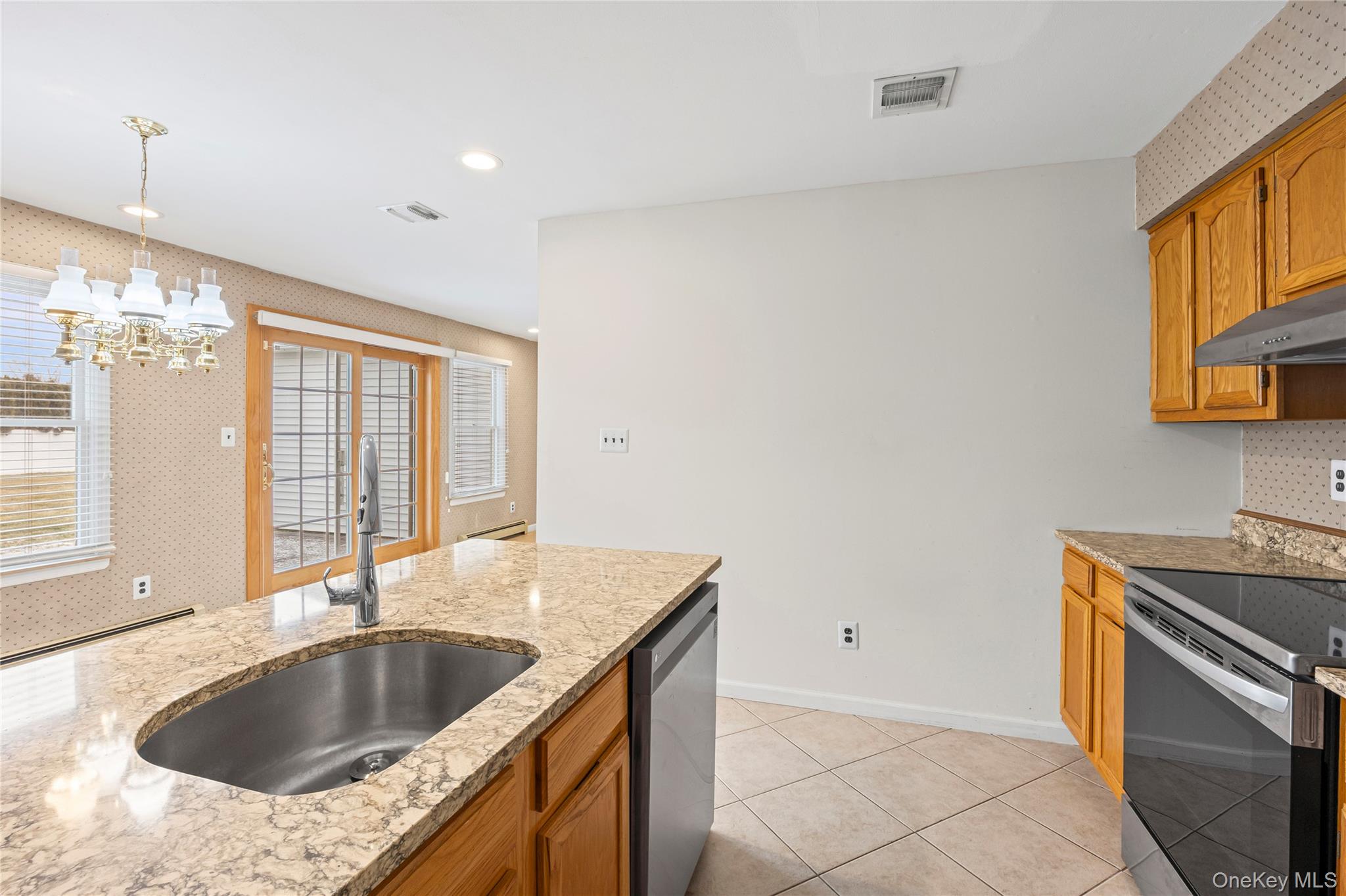 6 Hillview Court Commack, NY 11725 - Photo 31 of 43 a kitchen with granite countertop a sink and a stove