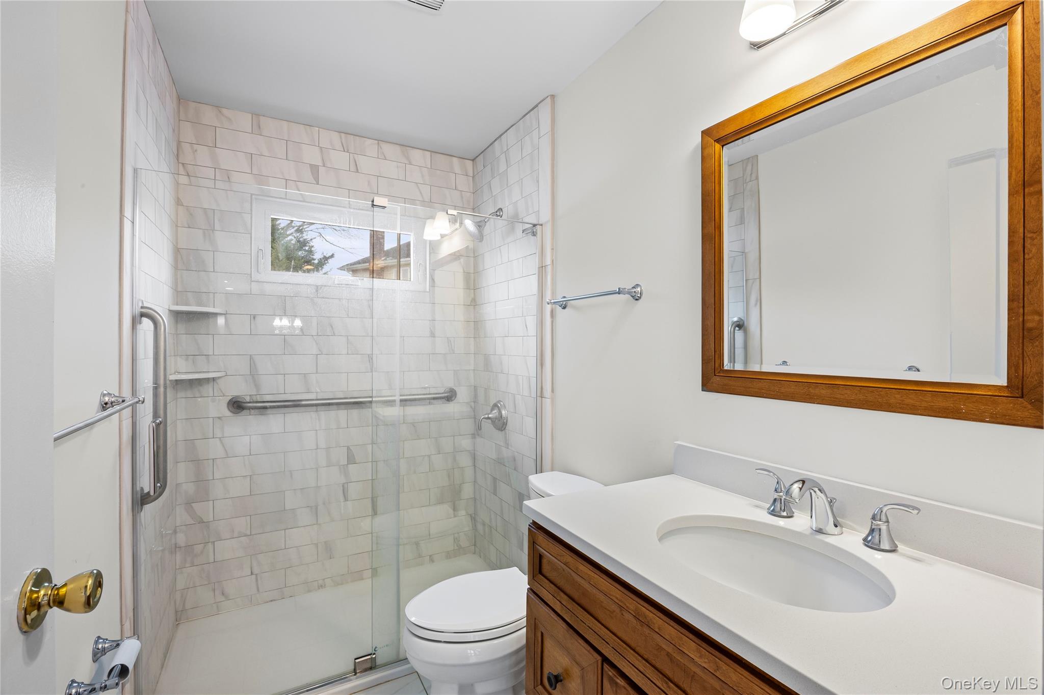 6 Hillview Court Commack, NY 11725 - Photo 34 of 43 a bathroom with a sink toilet and shower