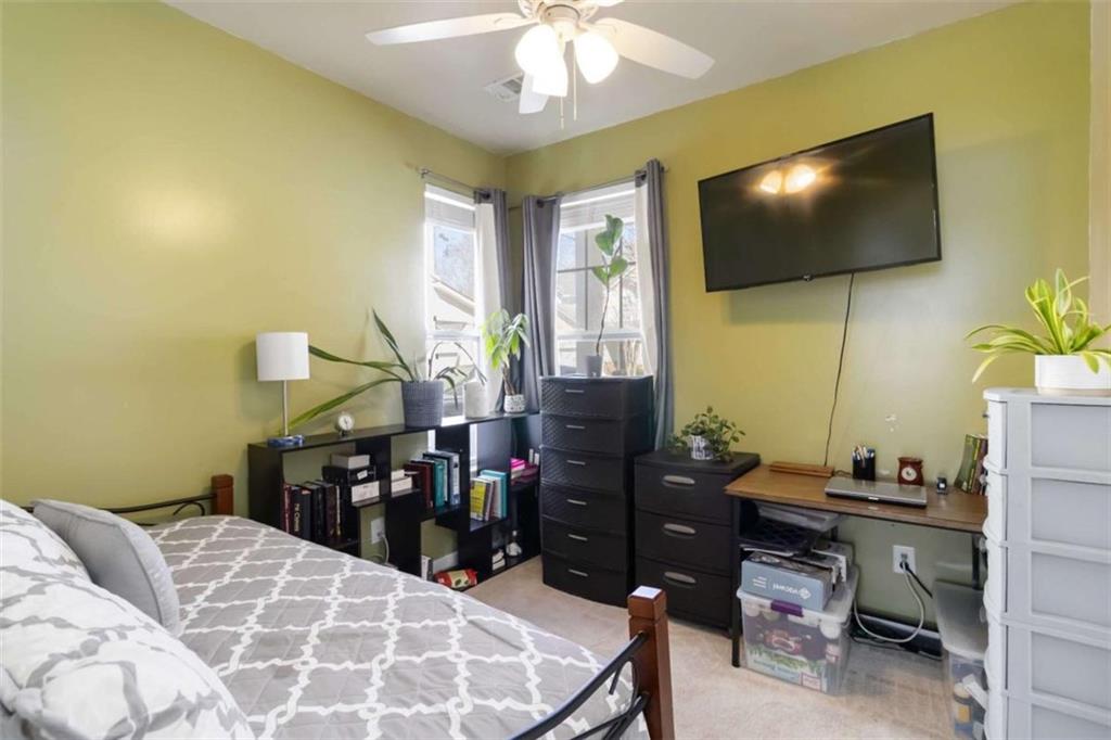 782 Jasperson Court Fairburn, GA 30213 - Photo 12 of 30 a view of a livingroom with furniture and a flat screen tv
