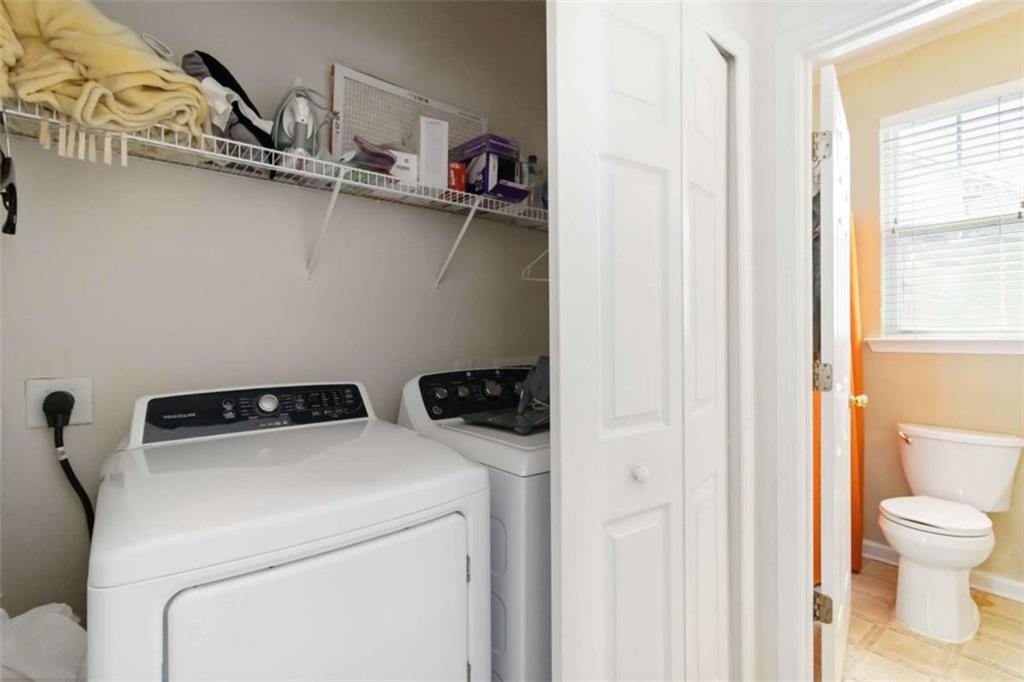 782 Jasperson Court Fairburn, GA 30213 - Photo 20 of 30 a utility room with dryer and washer