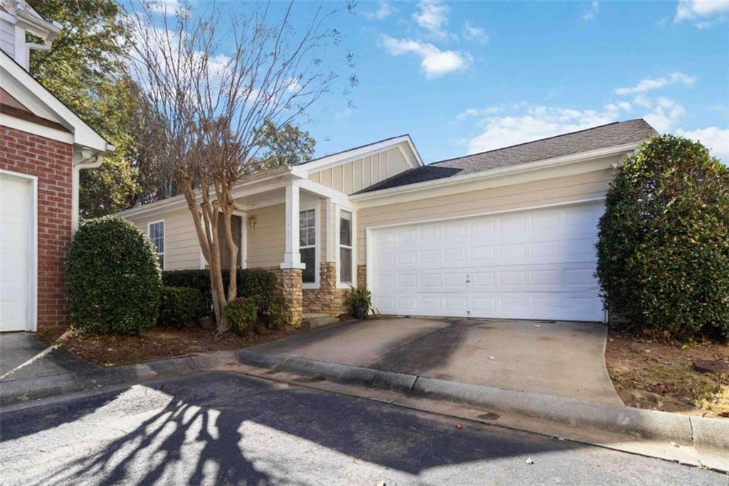 782 Jasperson Court Fairburn, GA 30213 - Photo 2 of 30 a view of a house with a yard and garage