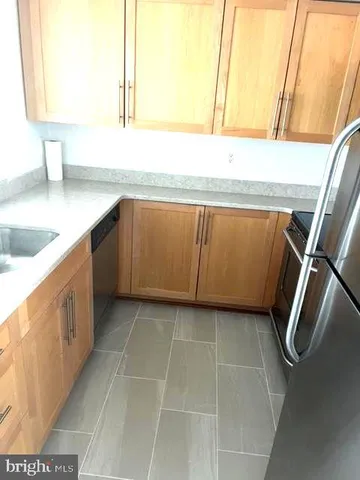 a kitchen with a sink and a vanity