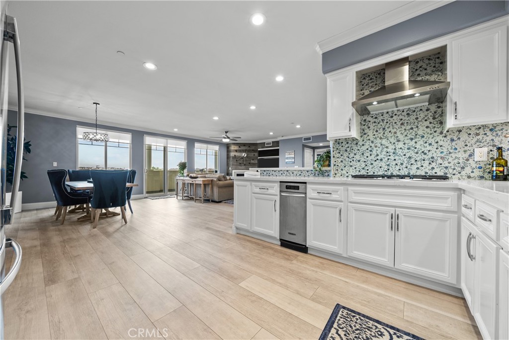 4344 Tradewinds Drive Oxnard, CA 93035 - Photo 14 of 57 a kitchen with white cabinets and sink