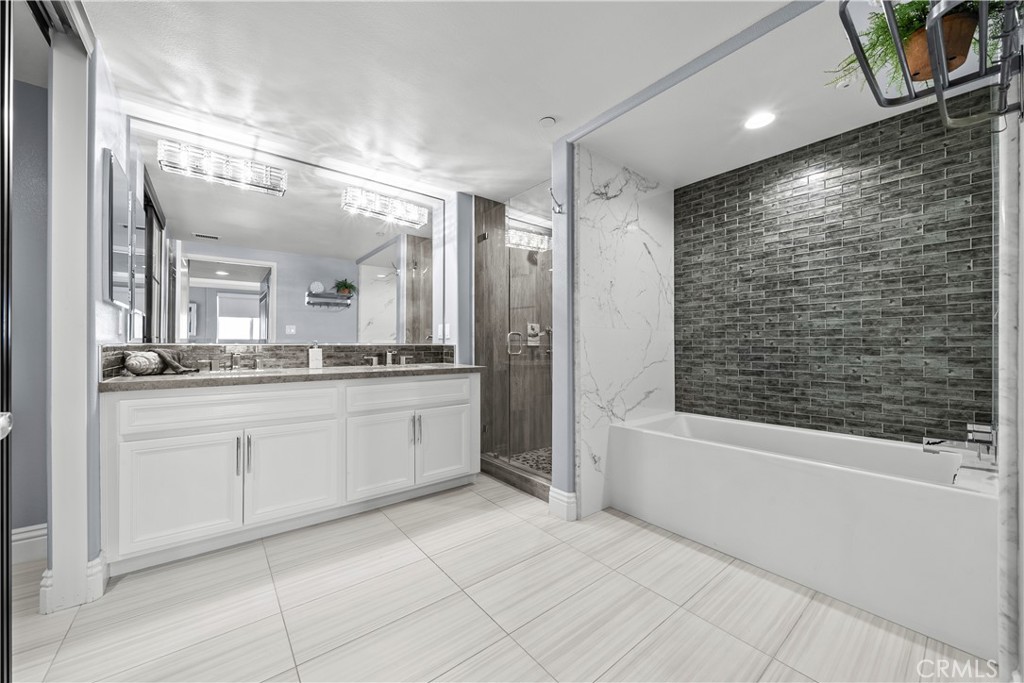 4344 Tradewinds Drive Oxnard, CA 93035 - Photo 20 of 57 a spacious bathroom with a shower a mirror and a bathtub