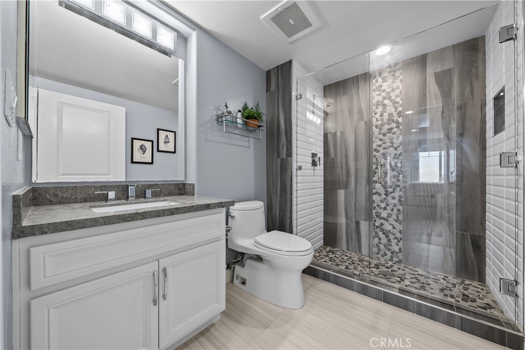 4344 Tradewinds Drive Oxnard, CA 93035 - Photo 28 of 57 a bathroom with a sink toilet and shower