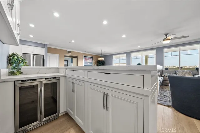 a kitchen that has a lot of cabinets in it and appliances
