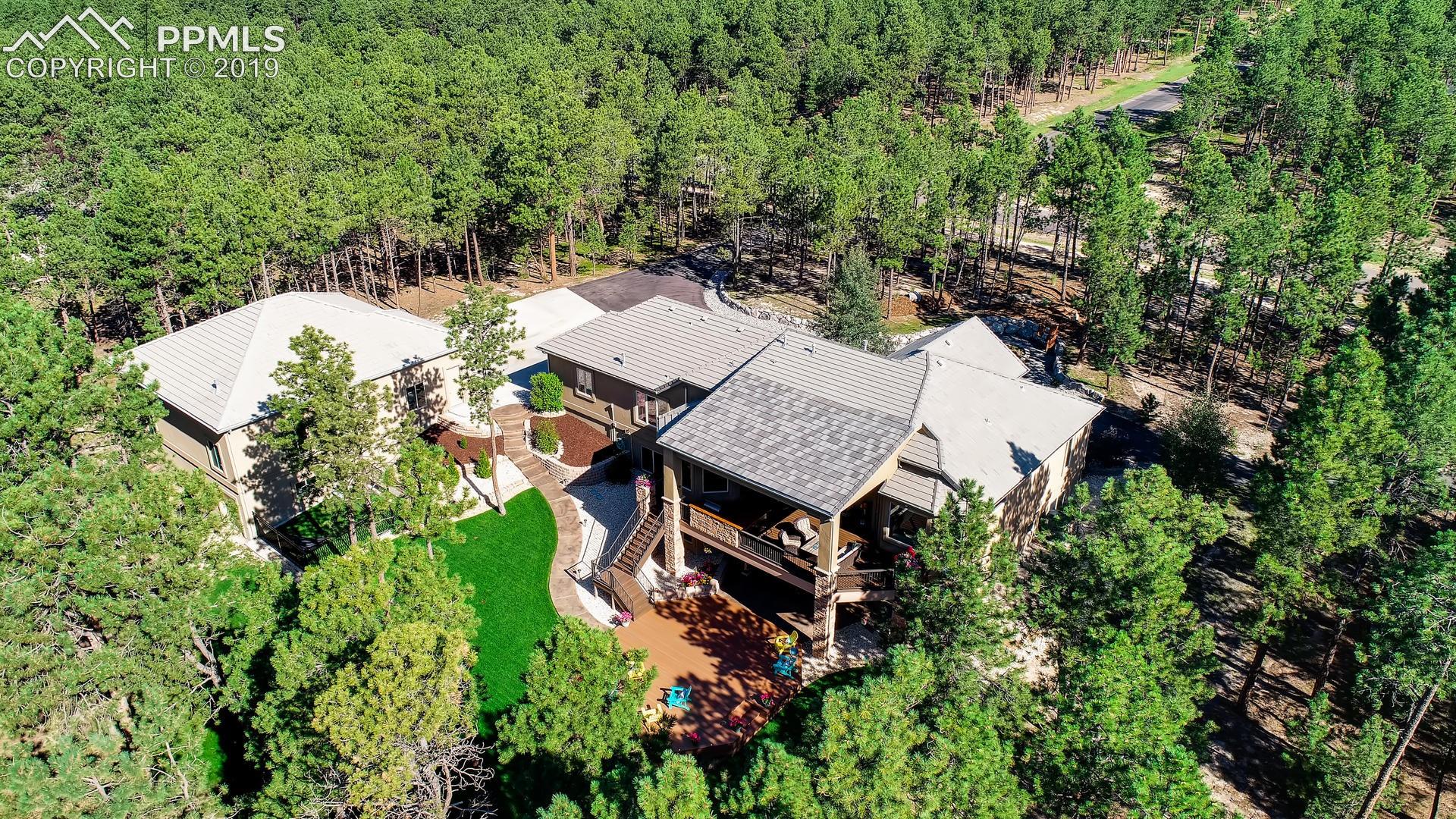 4061 High Forest Road Colorado Springs, CO 80908 - Photo 34 of 40 Situated beautifully within the tall pines.