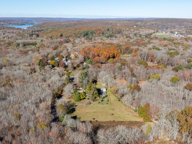 an aerial view of residential houses with beach
