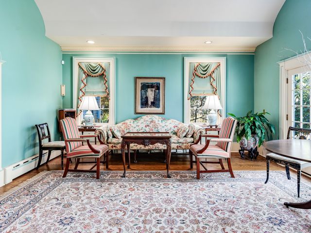 a living room with furniture and a rug