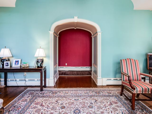 a view of hall way with furniture