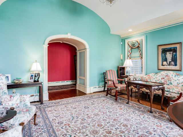 a living room with furniture gaming appliances and a couch