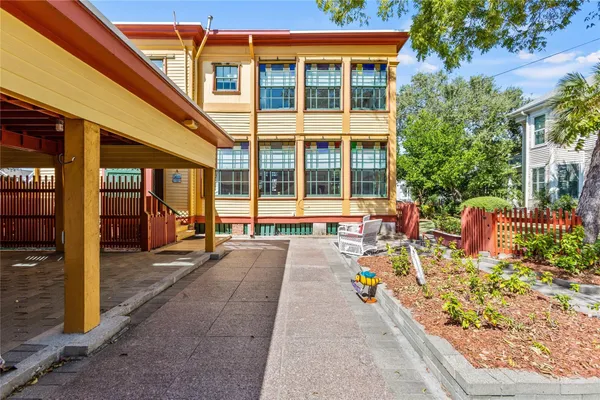 a front view of a building with outdoor seating