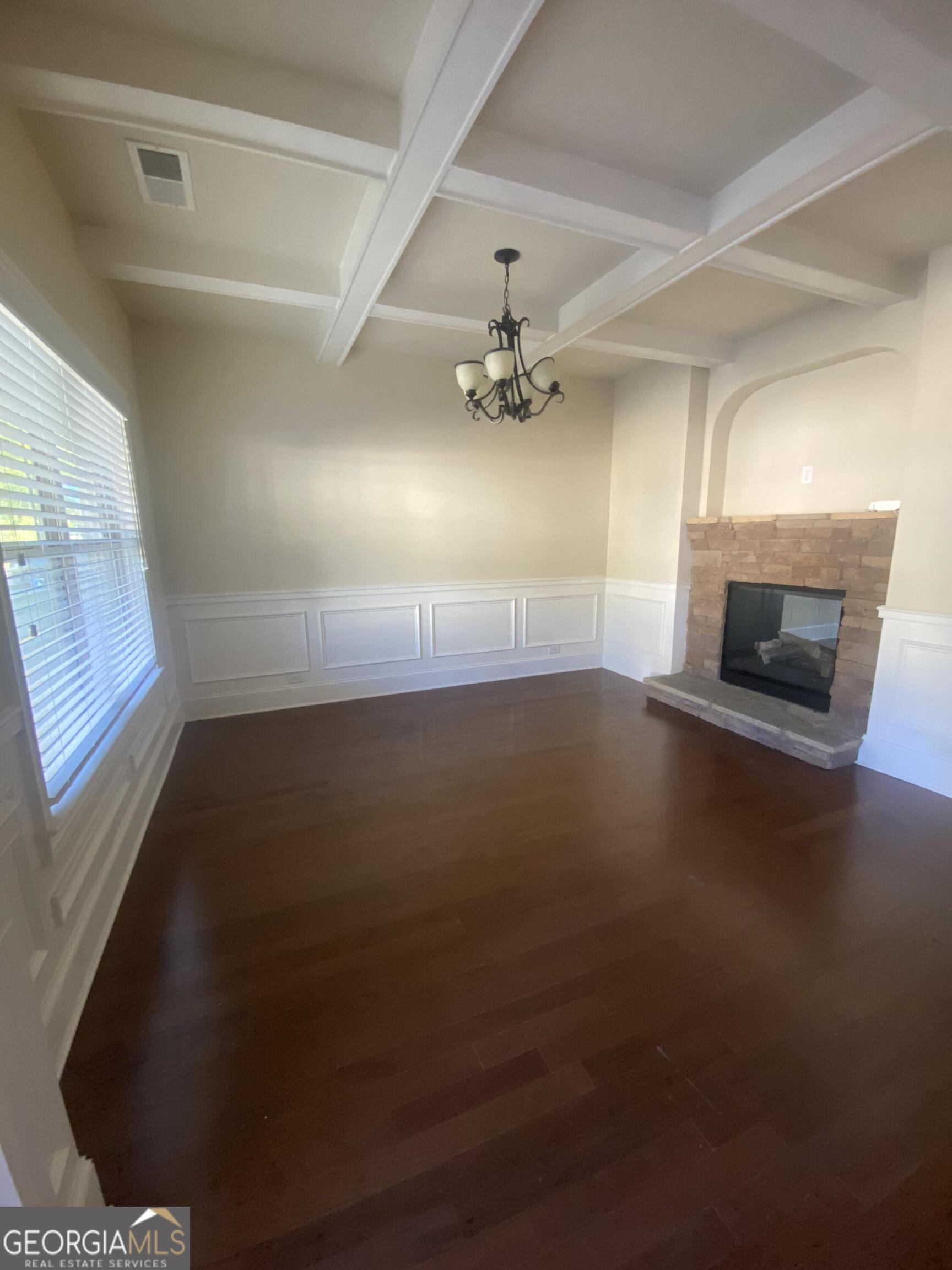 5441 Stirrup Way Powder Springs, GA 30127 - Photo 6 of 17 en empty room with windows and fireplace