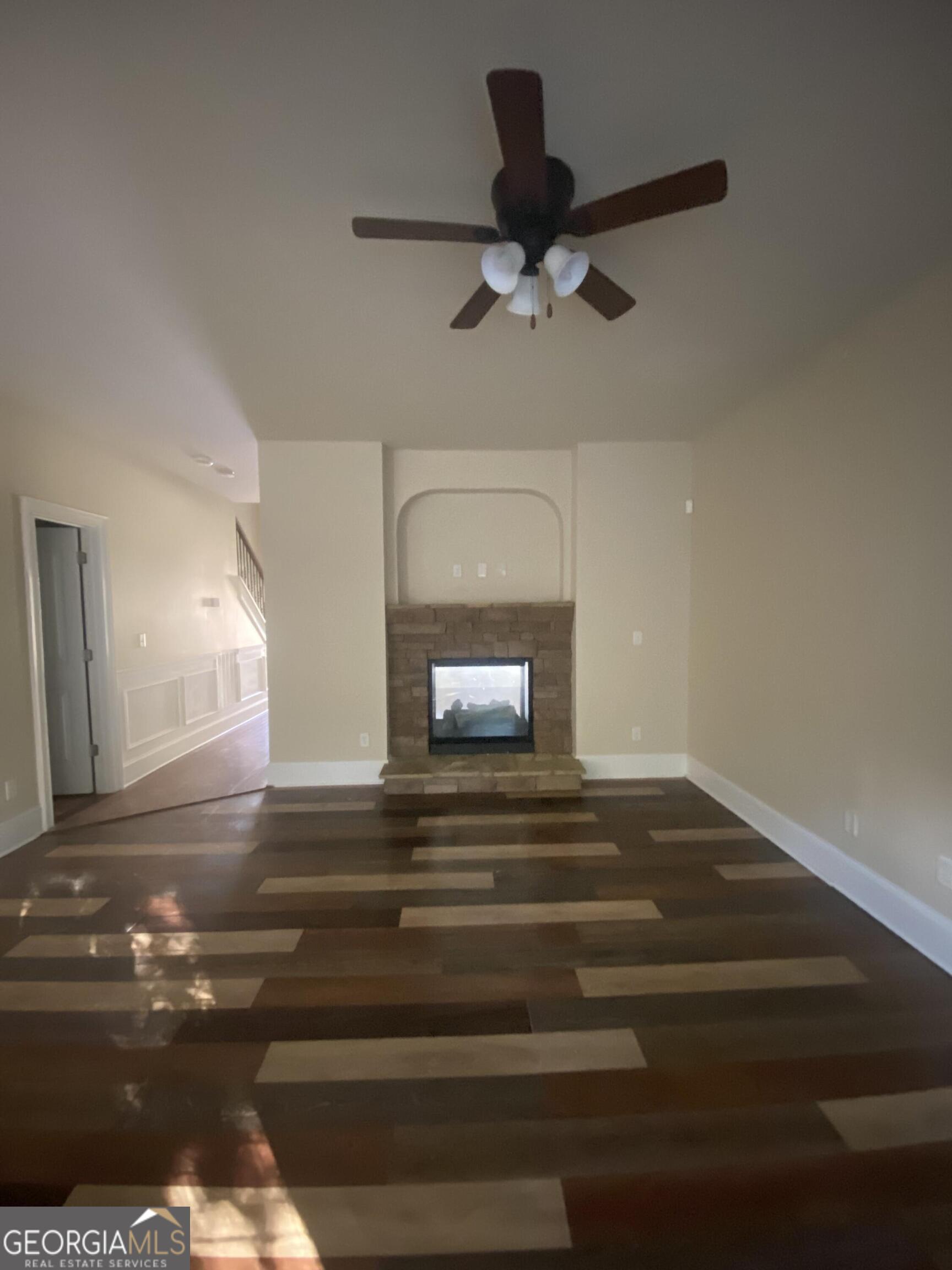 5441 Stirrup Way Powder Springs, GA 30127 - Photo 7 of 17 a view of entryway and hall with wooden floor
