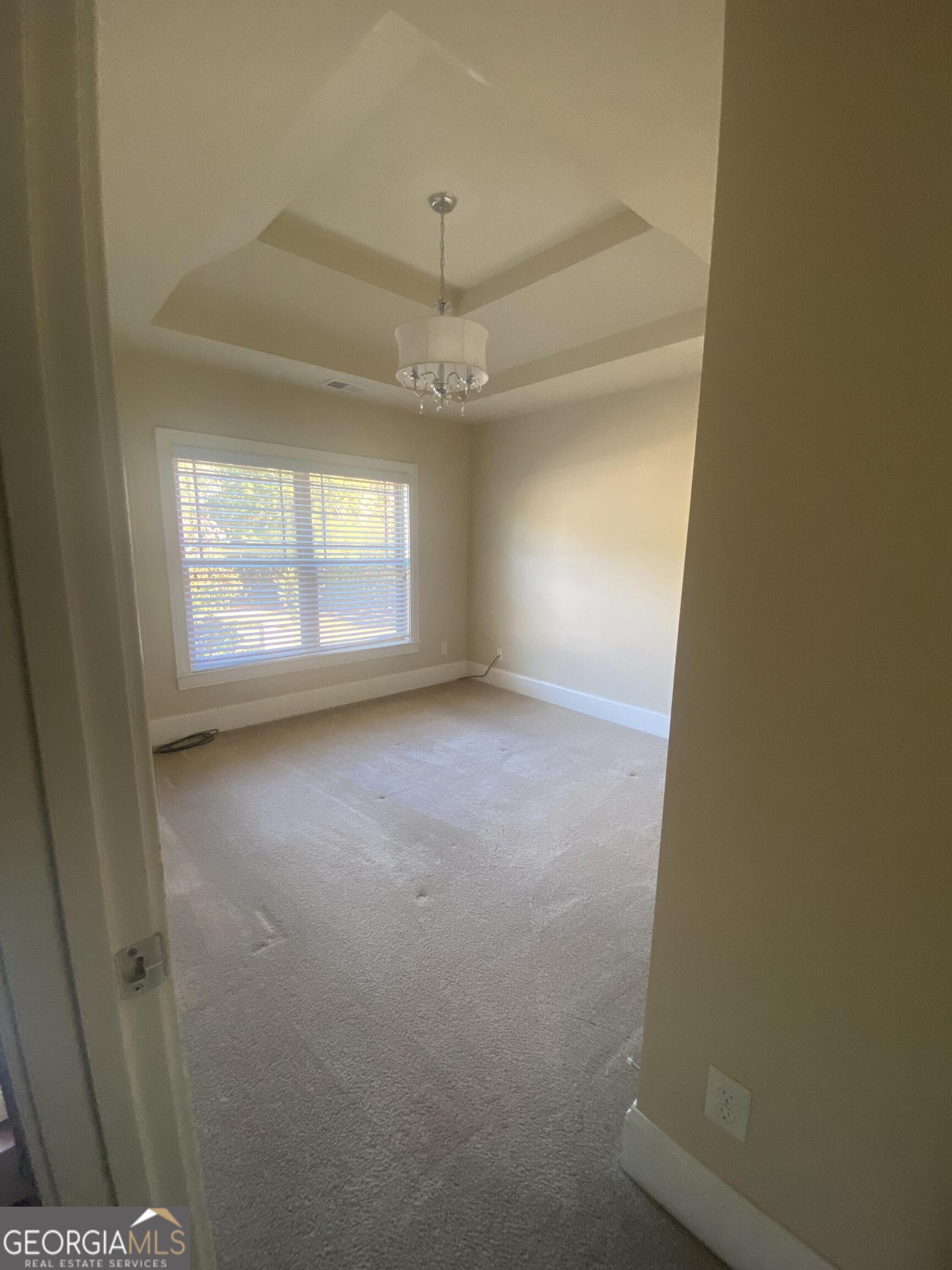 5441 Stirrup Way Powder Springs, GA 30127 - Photo 9 of 17 an empty room with windows and entrance