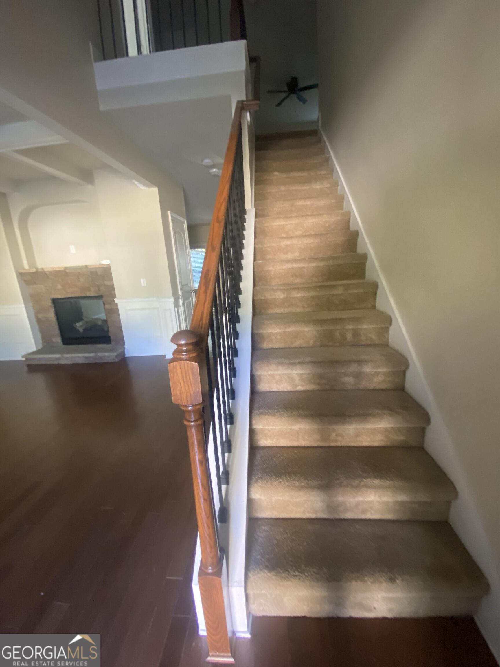 5441 Stirrup Way Powder Springs, GA 30127 - Photo 10 of 17 a view of entryway and hall with wooden floor