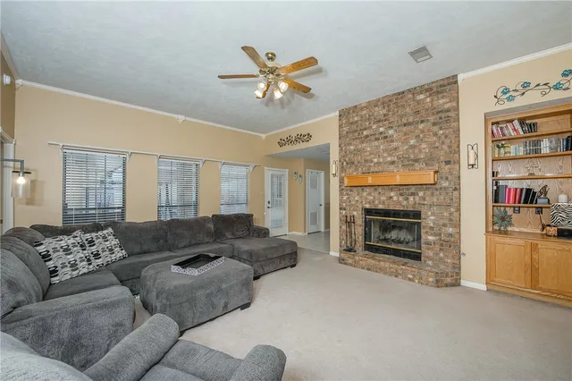 a living room with furniture or couch and a fireplace