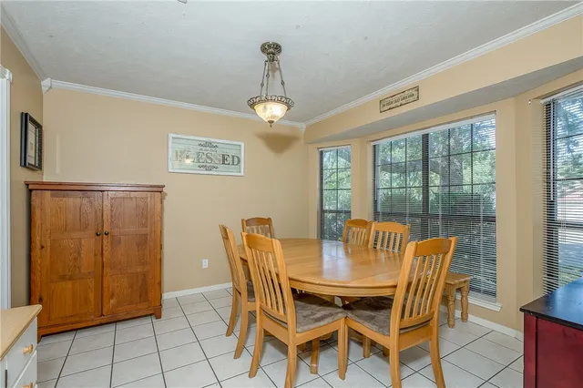 a view of a dining room with furniture window and outside view
