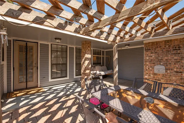 a backyard of a house with seating space