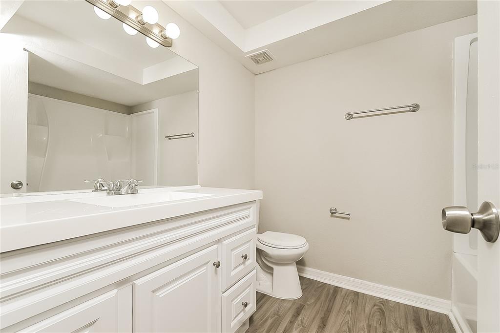 2902 Ripplewood Drive Seffner, FL 33584 - Photo 13 of 18 a bathroom with a sink a toilet and a mirror