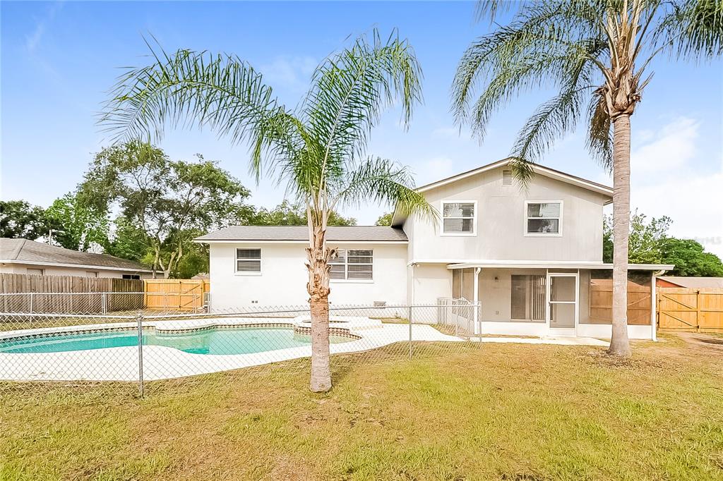 2902 Ripplewood Drive Seffner, FL 33584 - Photo 15 of 18 a house with palm tree in front of it