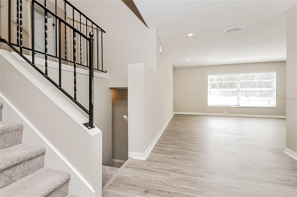 2902 Ripplewood Drive Seffner, FL 33584 - Photo 4 of 18 a view of an entryway with wooden floor